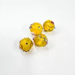 Set de 4 abalorios de cristal de Murano amarillo brillante